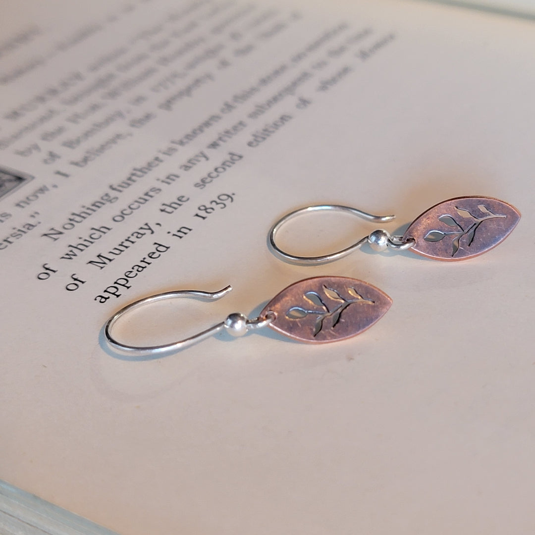 Floral designs cut into copper marquise dangle earrings