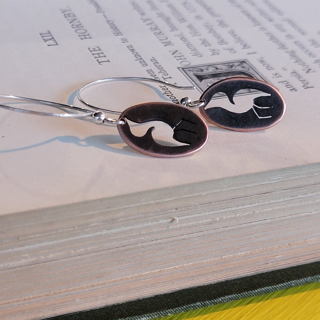 Cranes cut out of oval copper dangle earrings