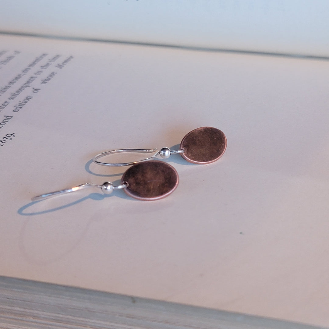 Oval copper dangle earrings on silver earwire