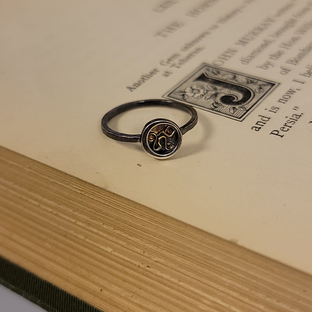 sterling silver ring with circle and gold accent