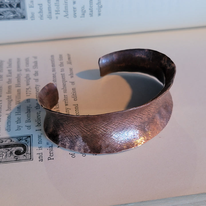 Anticlastic copper cuff with crosshatch detail